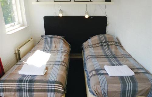 Postel nebo postele na pokoji v ubytování Awesome Home In Callantsoog With Kitchen