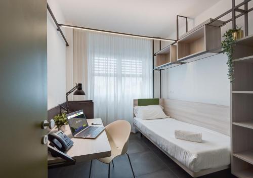 A bed or beds in a room at Camplus Guest Roma Casa per Ferie