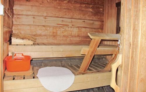 an inside view of a sauna with a bench and a stool at Awesome Home In Vemdalen With Sauna in Storhågna