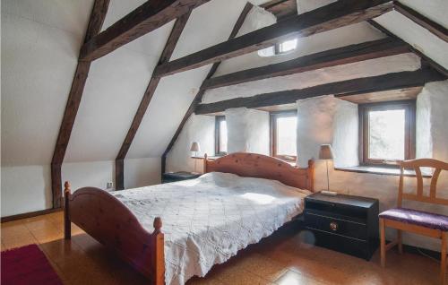 a bedroom with a large bed in a attic at Awesome Apartment In Havdhem With 3 Bedrooms And Wifi in Havdhem