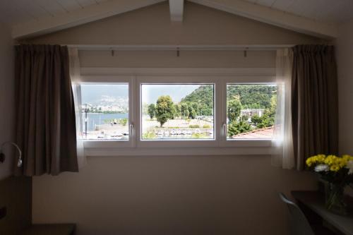 a window in a room with a view at Hotel Baia di Paré in Valmadrera