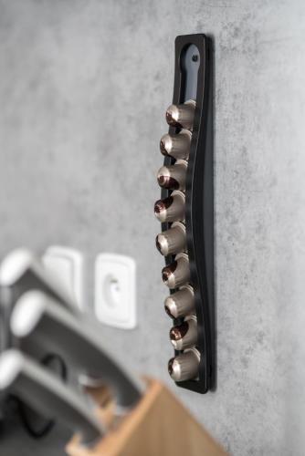 a black object is attached to a wall at MyApartment in the city center in České Budějovice