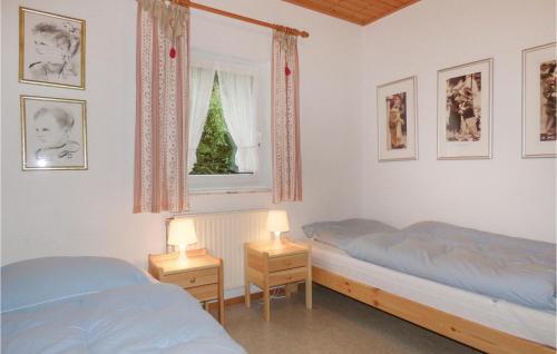 a bedroom with two beds and a christmas tree in it at Ferienhaus 14 In Thalfang in Thalfang
