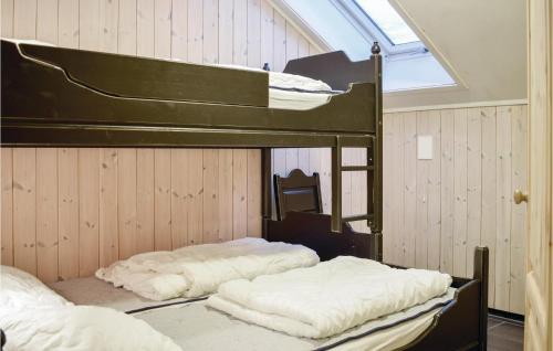 two bunk beds in a room with a window at 3 Bedroom Nice Apartment In Hemsedal in Hemsedal