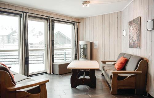 a living room with a couch and a table at Nice Apartment In Hemsedal With Sauna in Hemsedal