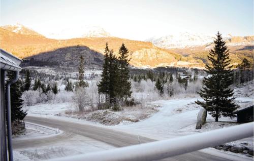 a view of a road with trees and mountains at Nice Apartment In Hemsedal With Sauna in Hemsedal