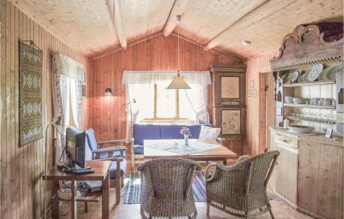 a room with a table and chairs and a kitchen at Beautiful Home In Hemsedal With Kitchen in Markegardlian