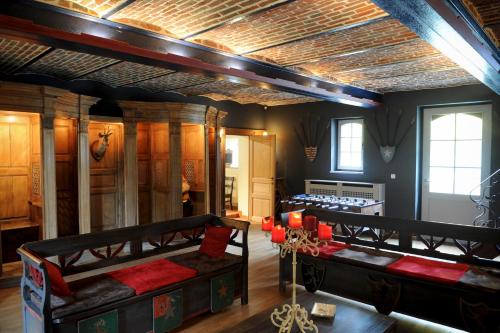 a room with two bunk beds in a room at Les Confidences de Messire Sanglier, stylished guest houses in Beauraing
