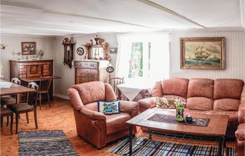 a living room with a couch and chairs and a table at 3 Bedroom Lovely Home In Vimmerby in Vimmerby