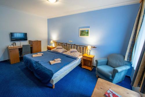 Postel nebo postele na pokoji v ubytování Hotel Rustikal