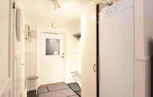 a hallway with a door leading into a room at Cozy Home In Sysslebäck With Kitchen in Branäs