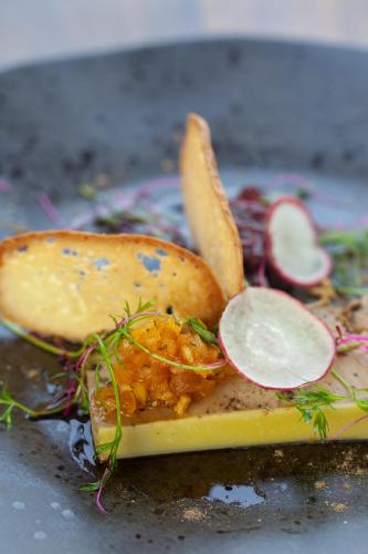 a plate of food with vegetables and fruit on it at Cradle Boutique Hotel in Lanseria
