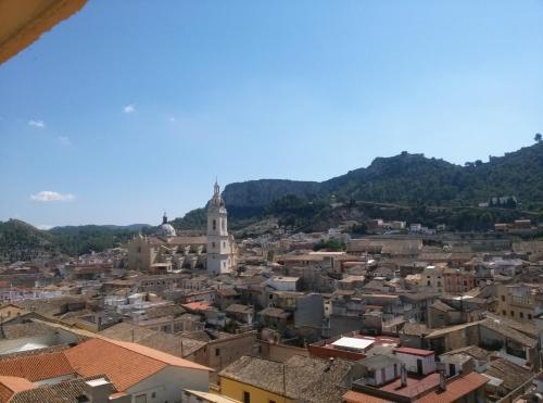 a view of a city with mountains in the background at Las Coles Apartasuites in Xàtiva