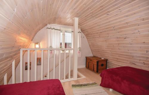 an attic room with a wooden ceiling and a staircase at Beautiful Home In Larv With 1 Bedrooms And Wifi in Larv