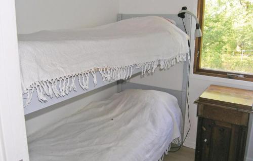 a bunk bed in a room with a window at Holiday Home Håknehult Lidhult in Lidhult
