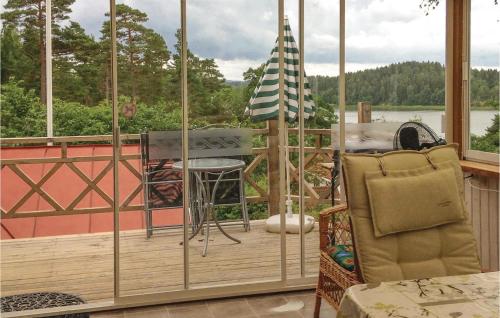a screened in porch with a view of the water at Rodebo in Ljungskile