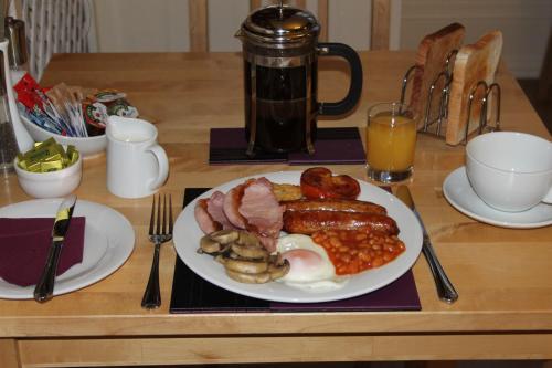 a plate of breakfast food on a table at Sunflower Lodge in Bridlington