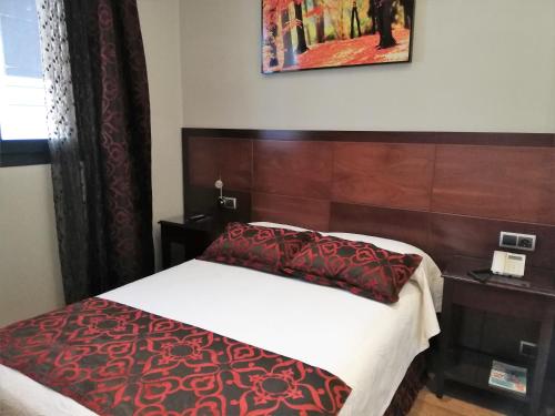 Ένα ή περισσότερα κρεβάτια σε δωμάτιο στο Hotel LB Lebrija by MA 22 Puntos