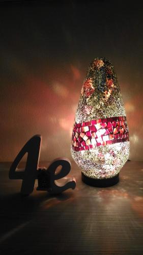 a glass egg sitting next to a pair of scissors at al 4e in Montopoli in Val dʼArno
