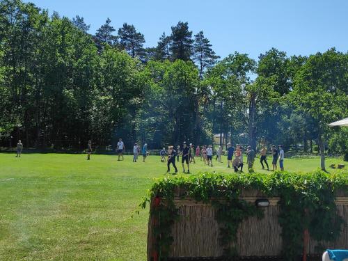 a group of people playing soccer in a field at White House puhkemaja in Uulu