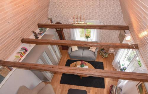 an overhead view of a living room with wooden beams at 1 Bedroom Pet Friendly Home In Larv in Larv