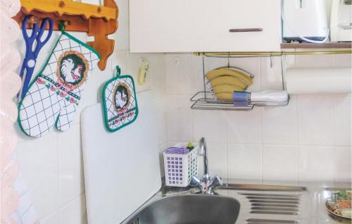 a kitchen with a sink and a counter top at Holiday Home Harzgerode Ot Neudorf Lxxiii in Neudorf