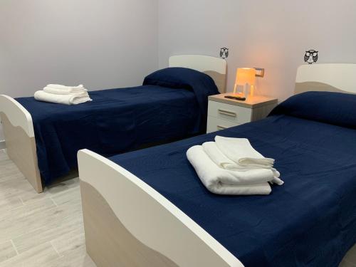 Ένα ή περισσότερα κρεβάτια σε δωμάτιο στο B&B La Corte