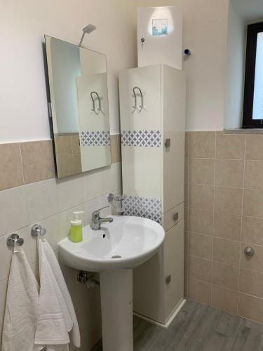 a bathroom with a sink and a mirror at B&B La Corte in Santa Maria Capua Vetere