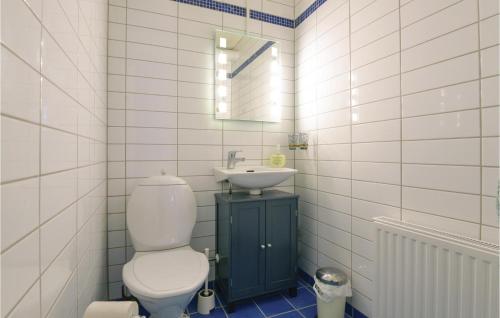 a bathroom with a toilet and a sink at Awesome Apartment In Grythyttan in Grythyttan