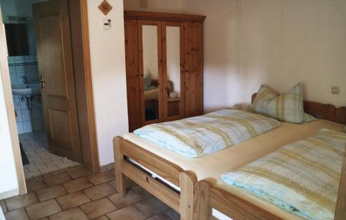 a bedroom with two beds and a bathroom at Nice Home In Thierstein With Wifi in Thierstein