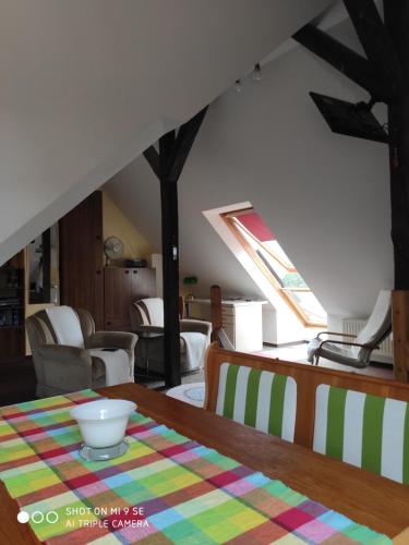 a living room with a table with a bowl on it at Apartment unterm Dach in Wismar