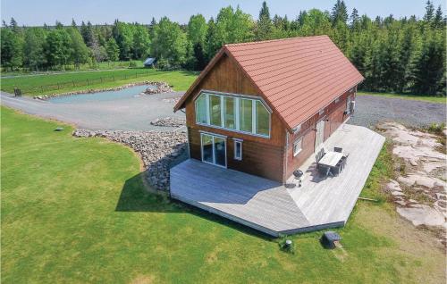 an overhead view of a small house with a deck at Beautiful Home In Aneby With Wifi in Aneby