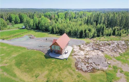 an aerial view of a small house on a field at Beautiful Home In Aneby With Wifi in Aneby