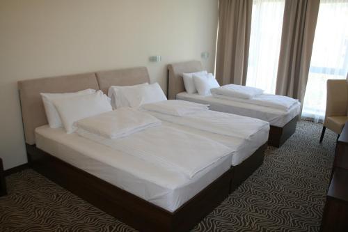 Кровать или кровати в номере Hotel Franca
