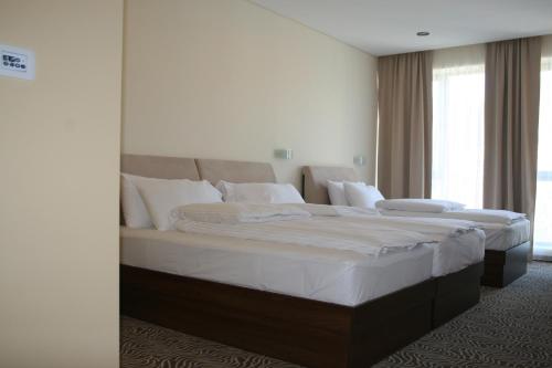 Кровать или кровати в номере Hotel Franca