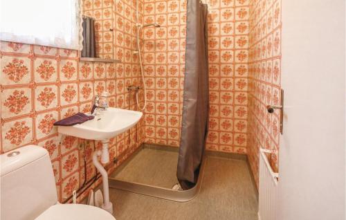 a small bathroom with a sink and a shower at Beautiful Home In Fegen With 1 Bedrooms And Wifi in Fegen