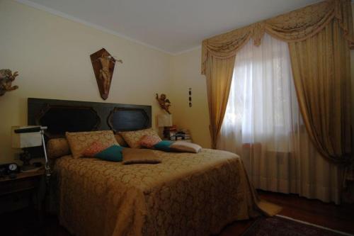 Ein Bett oder Betten in einem Zimmer der Unterkunft Conca di Sopra