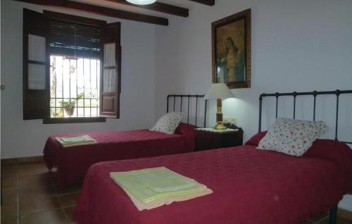 A bed or beds in a room at Stunning home in Pizarra with Internet, Private swimming pool and Outdoor swimming pool