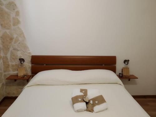 Postel nebo postele na pokoji v ubytování Historical Domus