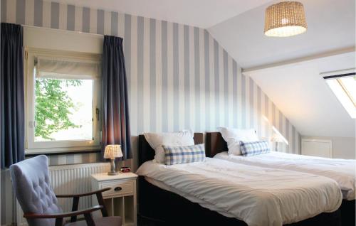 Postelja oz. postelje v sobi nastanitve Stunning Home In Boekel With 4 Bedrooms, Sauna And Wifi