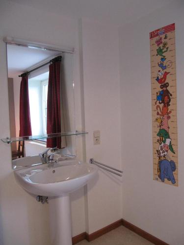 a bathroom with a sink and a mirror at Theux - La Reid in Theux