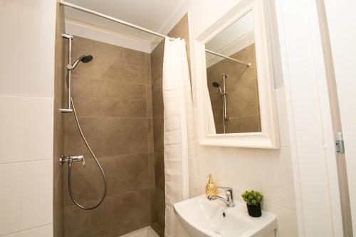 a bathroom with a shower and a sink at GOOD NIGHT | city Police (3km) | Szczecin | 2 pers in Szczecin