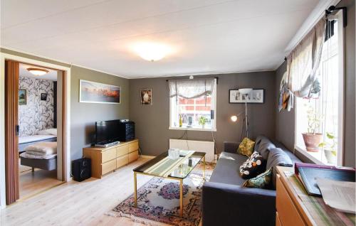a living room with a couch and a table at Beautiful Home In Väse With Kitchen in Ve