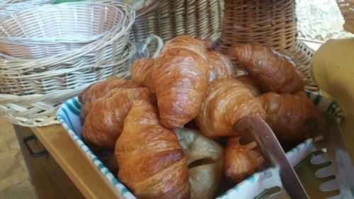 a basket filled with croissants and croissants at Gästehaus Hochkönig in Filzmoos