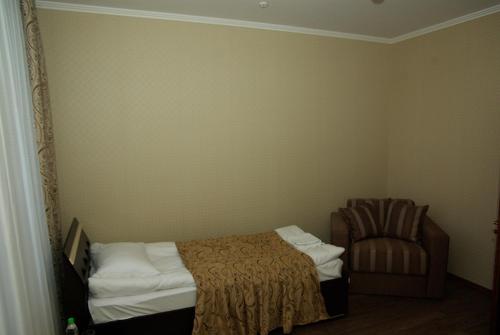 Postel nebo postele na pokoji v ubytování Hotel Deluxe