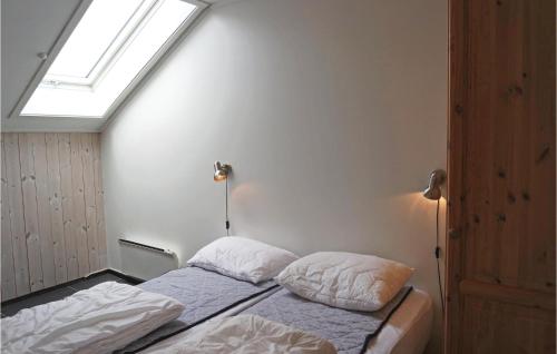 a bedroom with two beds and a skylight at Beautiful Apartment In Hemsedal With Sauna in Hemsedal