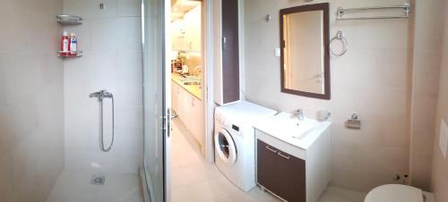 Ванна кімната в Apartments Exclusive