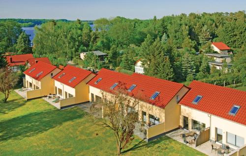 an overhead view of a row of houses with red roofs at 2 Bedroom Amazing Home In Pinnow in Petersberg