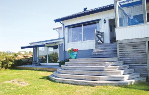 a house with steps leading up to the front porch at Villa Adenäs in Åsa