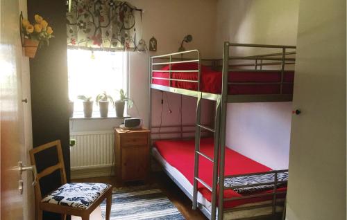 a room with two bunk beds and a window at Cozy Home In Borgholm With Wifi in Borgholm